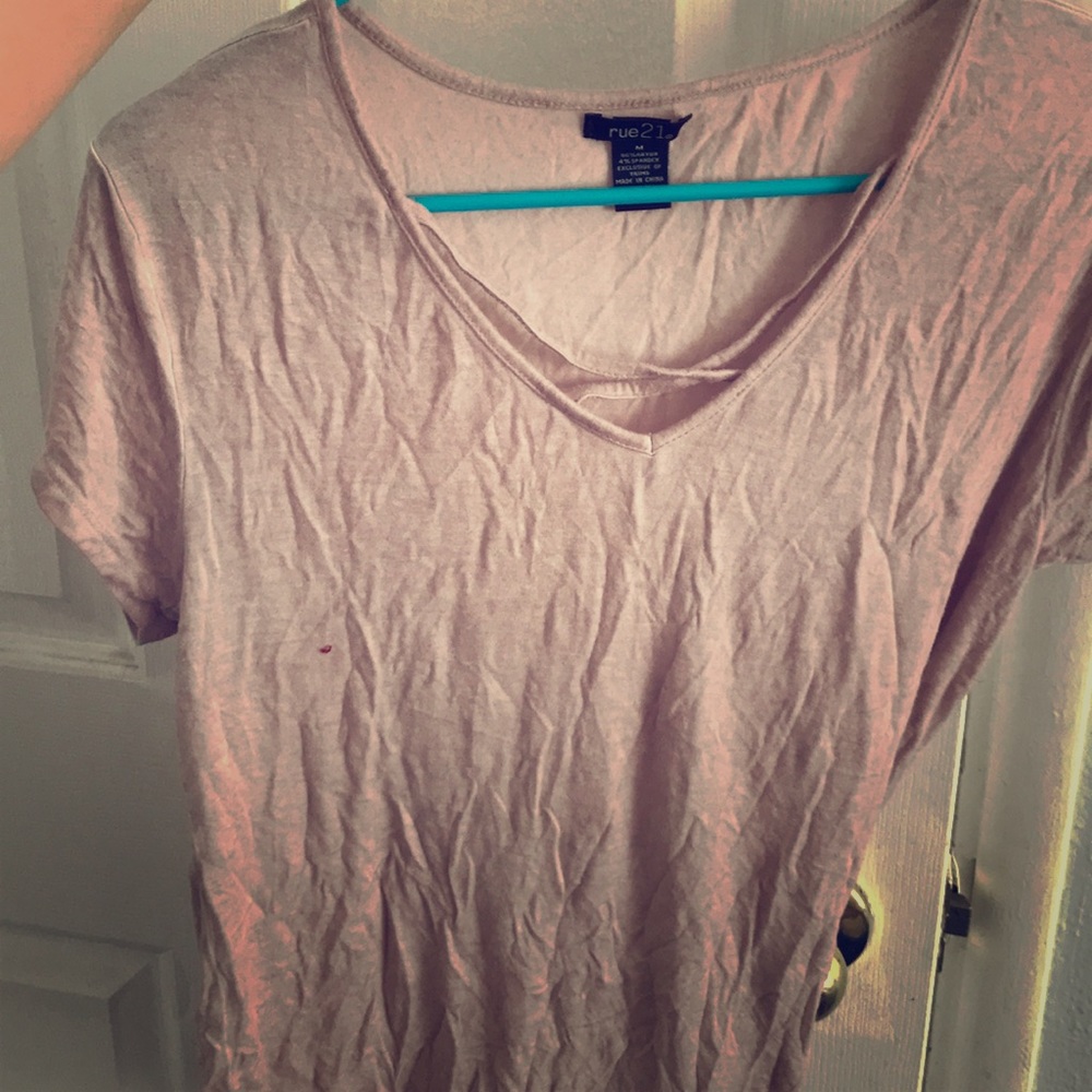 Light pink shirt with a crossover on the front